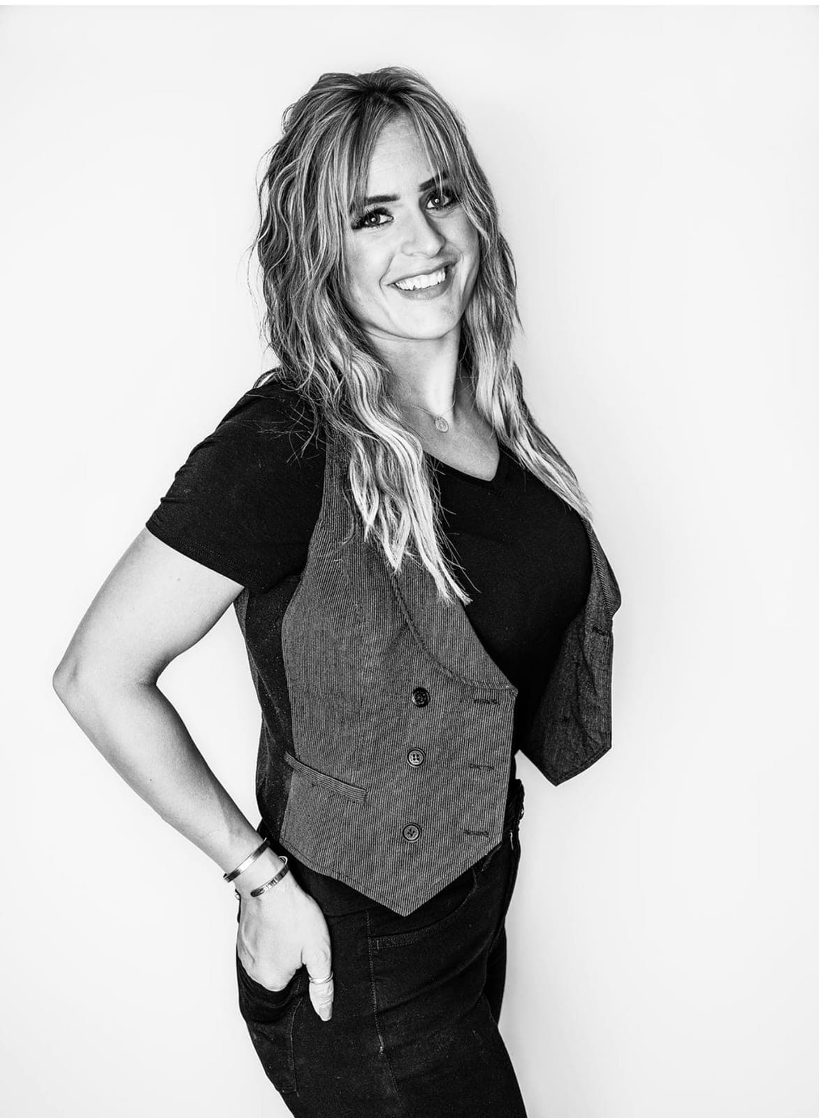 Studio portrait of Alisa Sampson in black against a clean backdrop