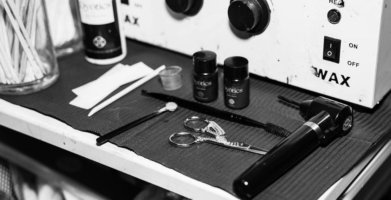 Black-and-white brow and lash workstation detail